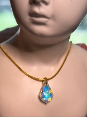 Pink baroque crystal on gold chain. 16”.